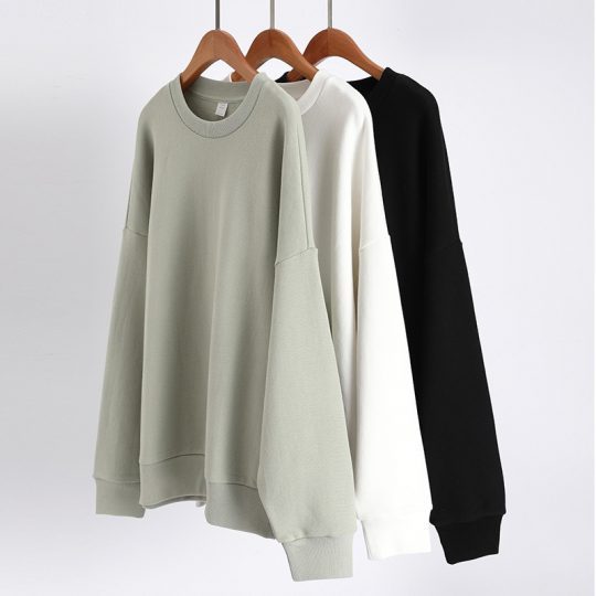 Three Cutom Sweatshrits Hanging, Making A Perfect Clothing Product Image