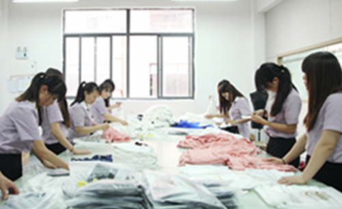 Workers Busy at Doing Garment Quality Control upon Details Before Packaging